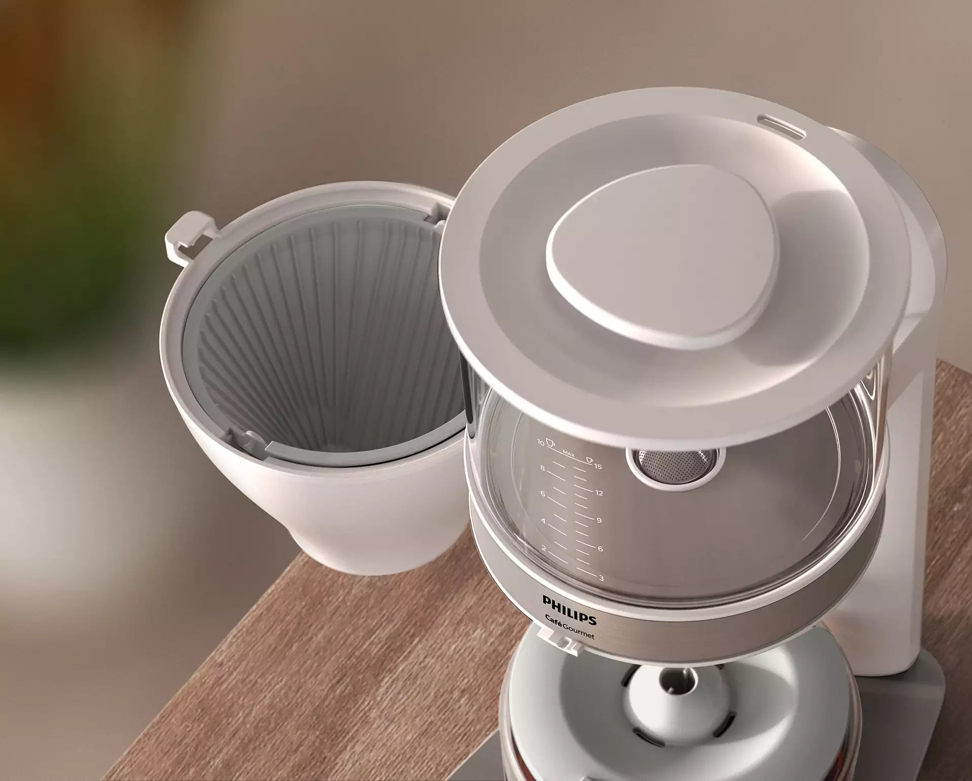 Billede af Philips HD5416/00 Café Gourmet filter kaffemaskine med åbent låg og filterholder placeret på en træoverflade. Maskinen har en glaskande med måleangivelser og er designet i et moderne, elegant look.