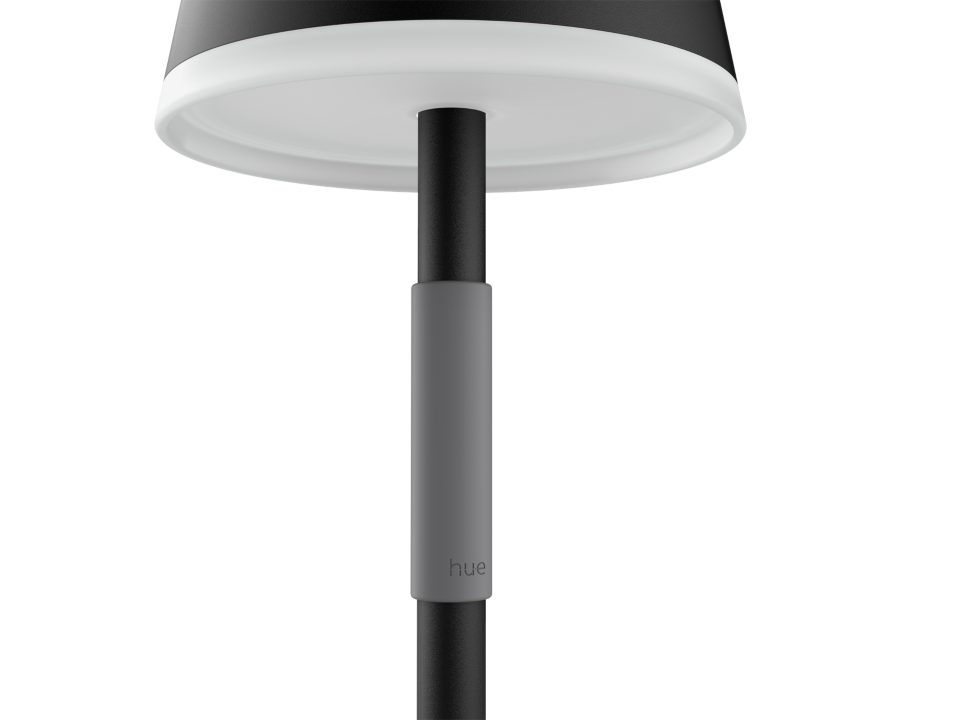 Philips Hue Go bærbar bordlampe i sort med enkel og moderne design der fremhæver en slank, sort lampefod og en rund lampeoverdel med en hvid kant