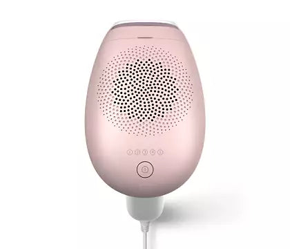 Philips BRI920/00 IPL hårfjerningsenhed Lumea IPL 7000 Series med en rund, glat pink overflade og perforeret mønster, designet til at være ergonomisk og brugervenlig, med knapper til indstillinger og en strømkabel tilsluttet.