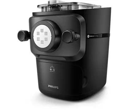 Philips HR2665/93 pastamaskine med en sort overflade og en rund skive foran til pastadannelse samt to knapper på siden til indstilling af funktioner