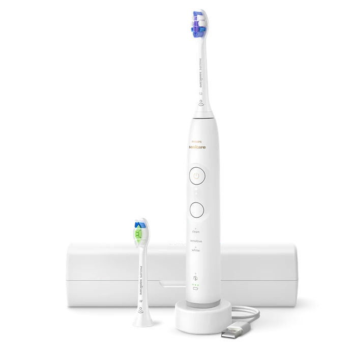 Philips Sonicare 6500 genopladelig tandbørste HX7410/02 med lysere og effektive børstehoveder samt opbevaringsetui til rejser. Tandbørsten har knapper til rengøring, skånsom og hvid funktion. Børsten står på en ladestation og har et moderne hvidt design.