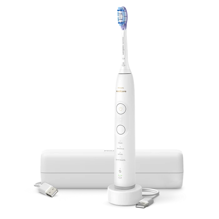 Philips genopladelig eltandbørste Sonicare Serie 7100 HX7420/01 med børstehoved og ladestation i hvidt design samt tilsluttet USB-kabel og opladningsstation