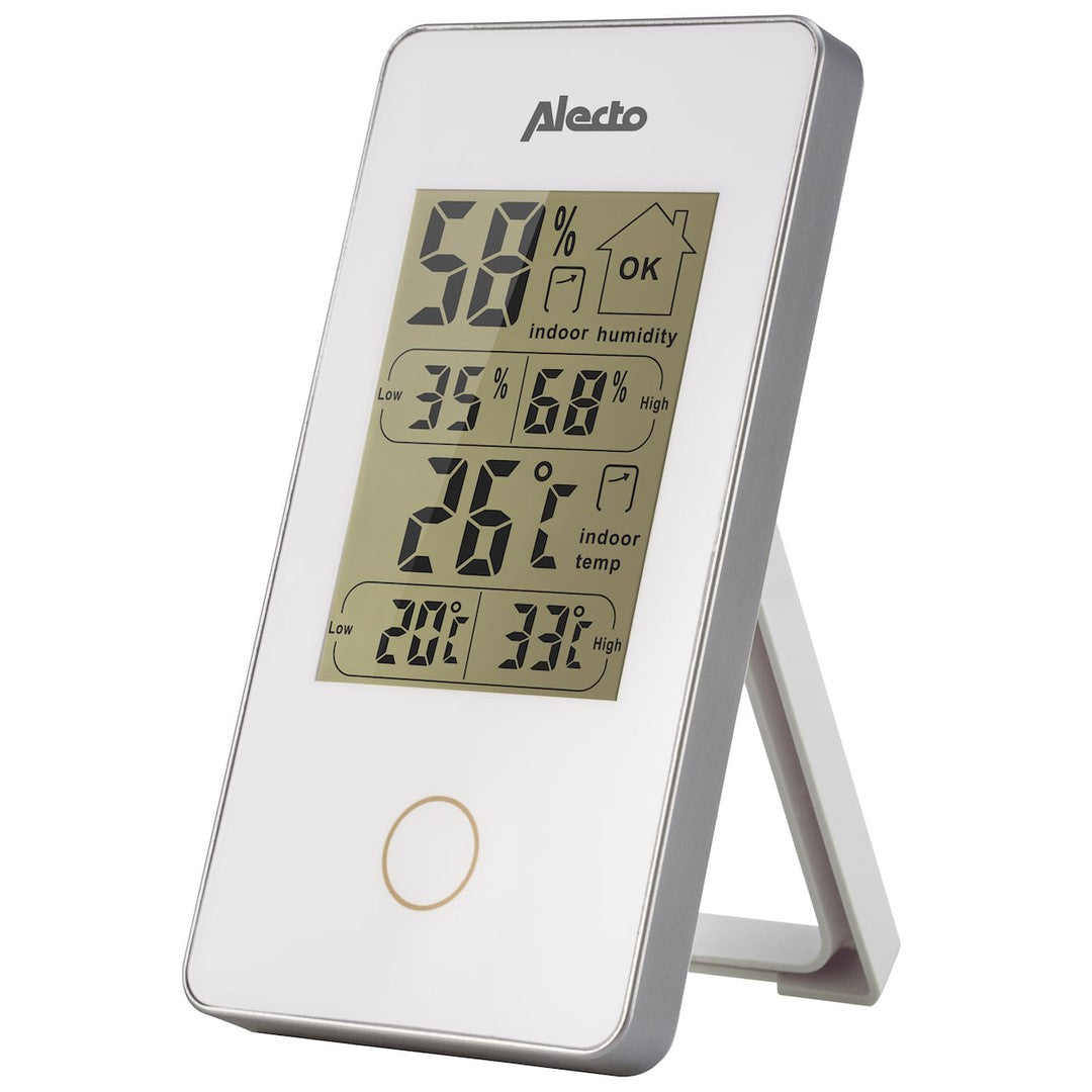 Digital indendørs thermometer og hygrometer fra Alecto med stort display der viser både temperatur og luftfugtighed samt lav- og høj værdi angivet for begge målinger designet med en stående støtte til at placere på en flad overflade