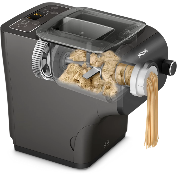 Billede af Philips HR2382/15 Avance Collection Pastamaskine der viser maskinens indre med dej og frisk pasta der presses ud af maskinen