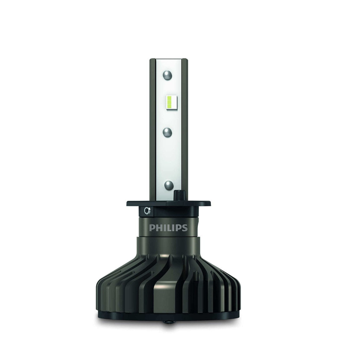 Philips Ultinon Pro9000 HL LED H1 pære med en strømlinet design i sort og sølv med en stor skiveformet base og LED lysindsats synlig på toppen