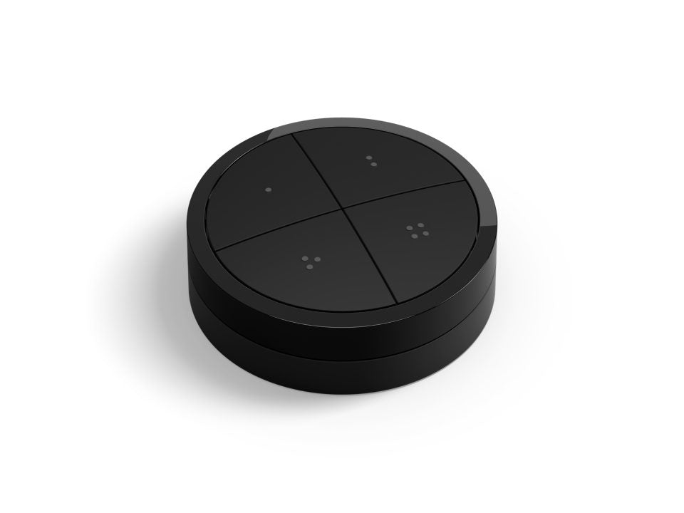 Philips Hue Tap dial switch i sort farve med fire synlige sektioner og lysdioder til betjening af belysning i hjemmet