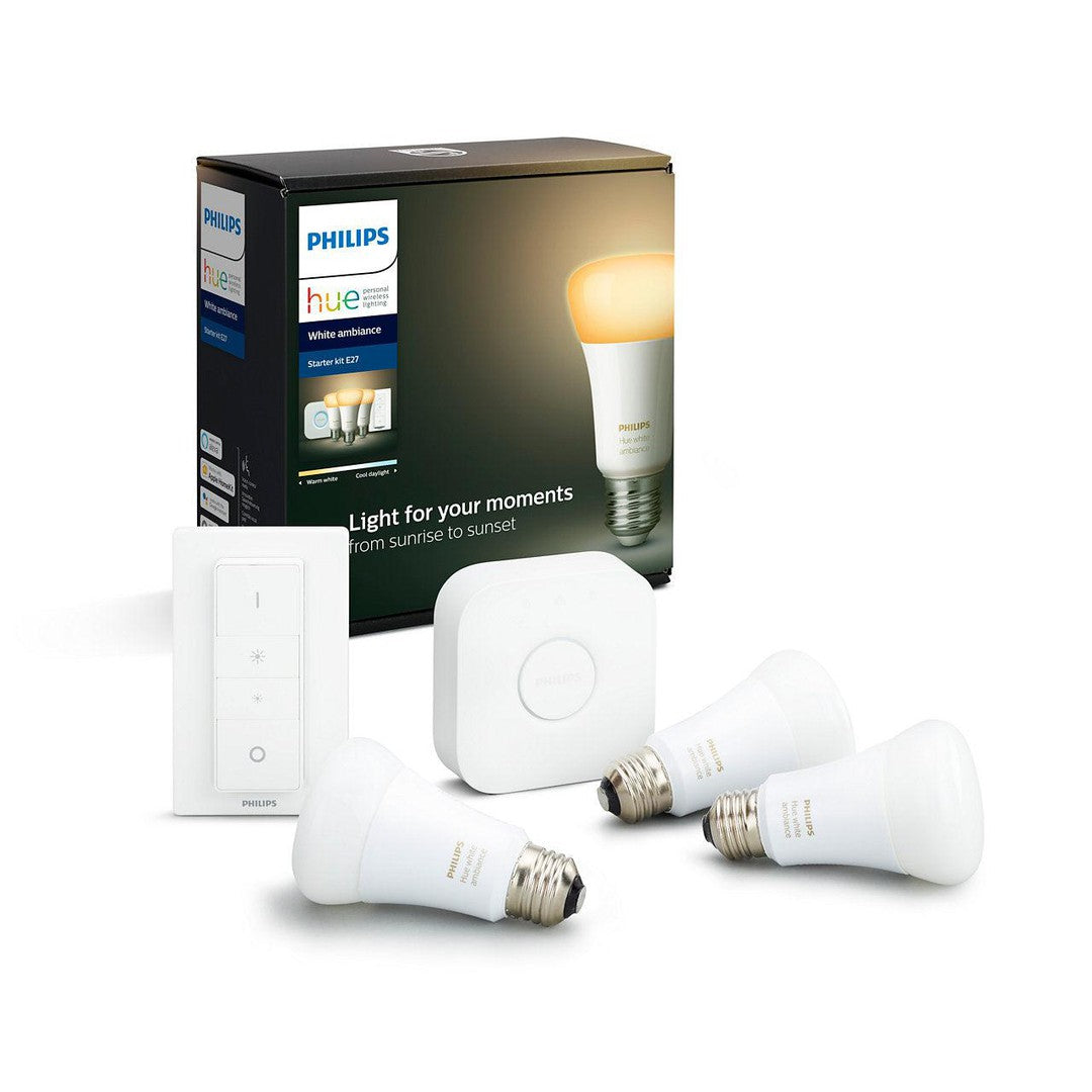 Produktbillede af Philips Hue white ambiance startsæt E27 som inkluderer tre lyskilder, en bridge og en switch i hvid farve emballeret i en dekorativ kasse.