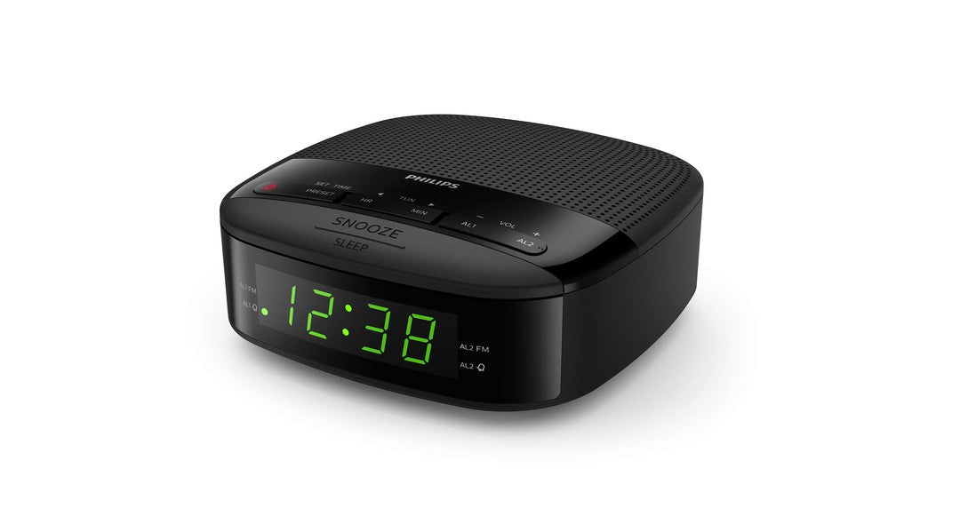 Philips TAR3205 vækkeur med grøn digital skærm der viser klokken 12.38 og betjeningselementer på toppen til snooze og lydstyrke i sort design