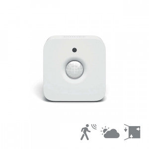 Philips Hue Bevægelsessensor i hvid farve med en rund sensor i midten og en lille LED indikator øverst på enheden