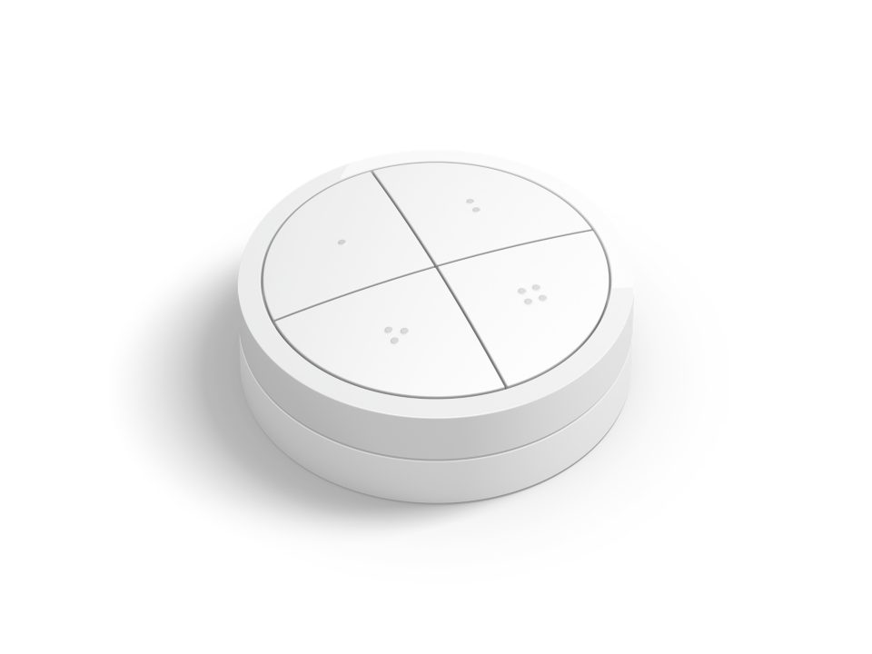 Philips Hue Tap dial switch i hvid farve med fire betjeningsområder og en afrundet form designet til nem montering og brug.