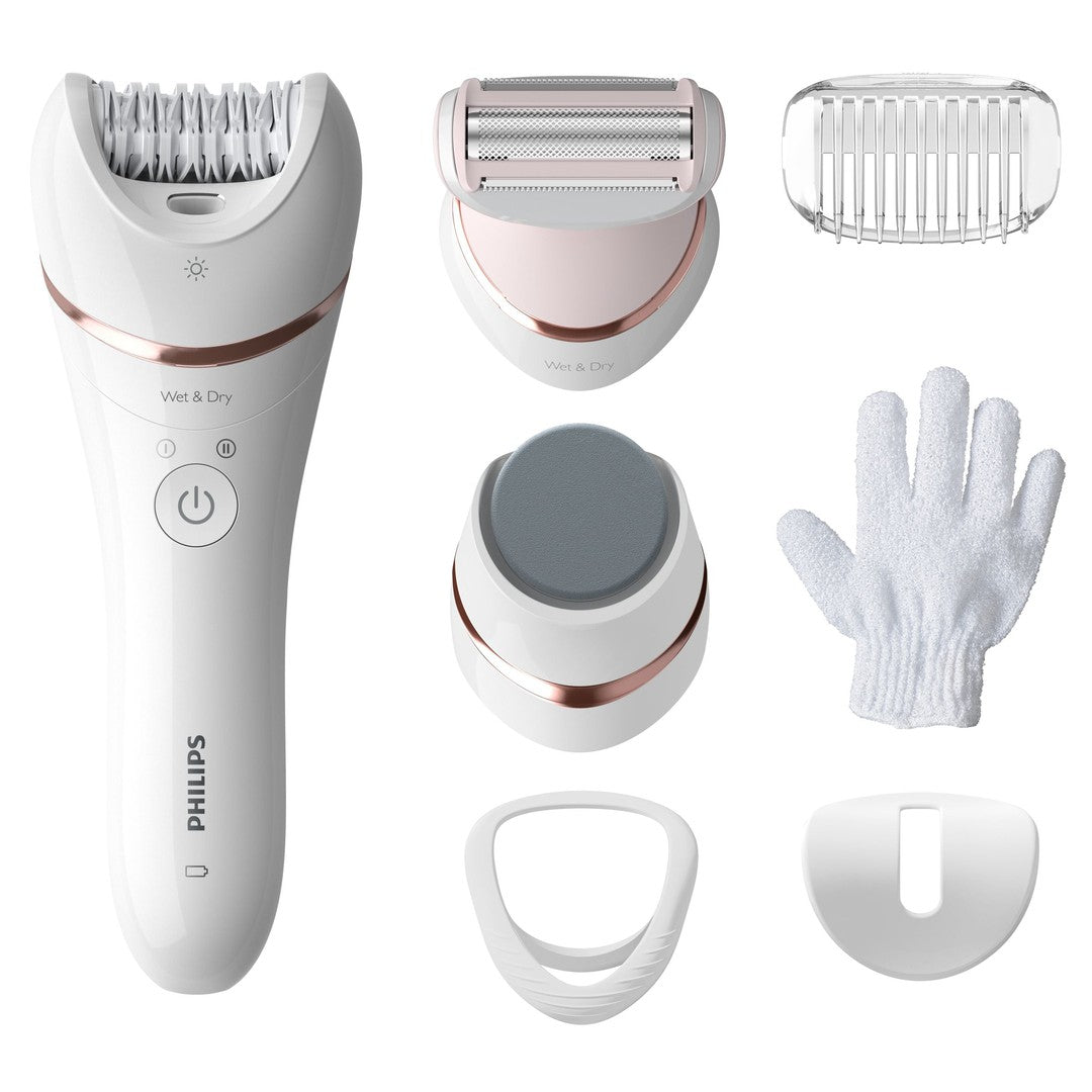 Epilator Philips BRE730/10 Wet & Dry med seks tilbehørsdele herunder barberhoved, skrubbebørste, eksfolieringshandske og valgfrie beskyttelsesdæksler i en elegant hvid og rosaguld farve.