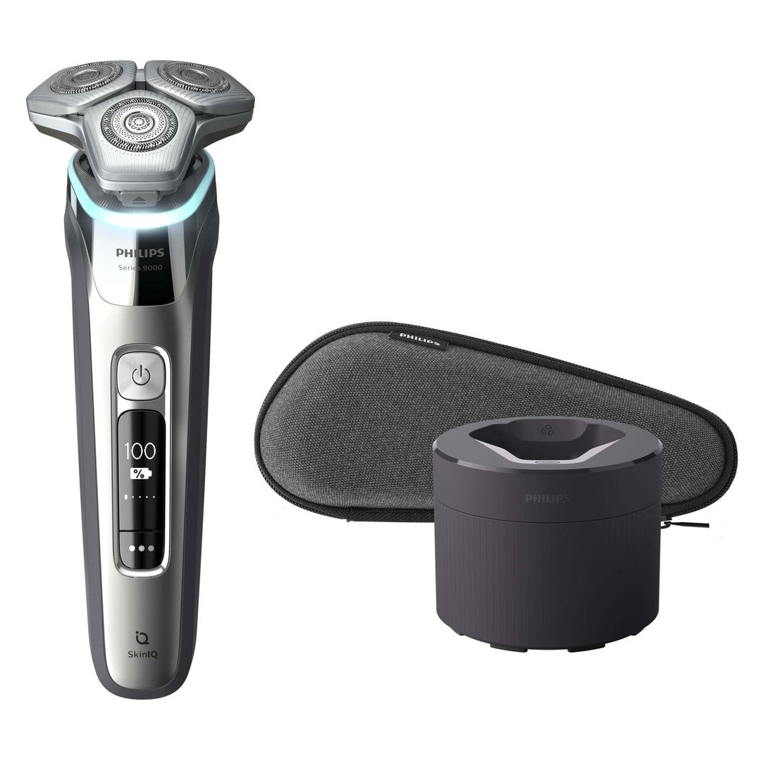 Billede af Philips S9985/50 elektrisk wet and dry barbermaskine fra serien 9000 med tre runde barberhoveder en ladestation og et beskyttende etui i grå farve med Philips logo