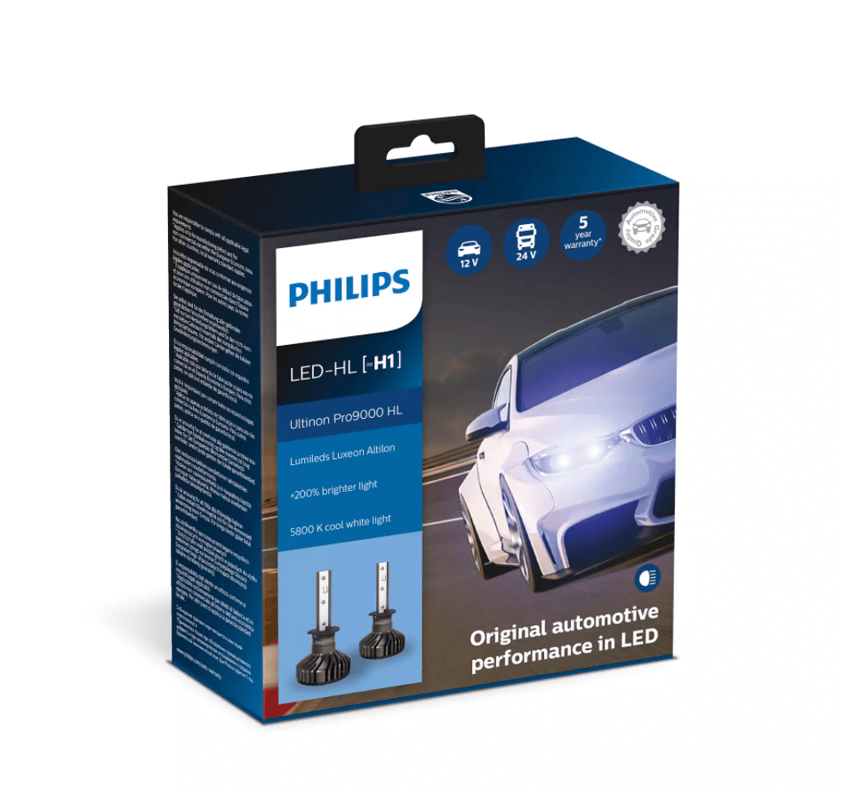 Pakken med Philips Ultinon Pro9000 HL LED H1 billys lygter præsenterer produktinformationer og specifikationer med en moderne bil i baggrunden der viser lysene i aktion
